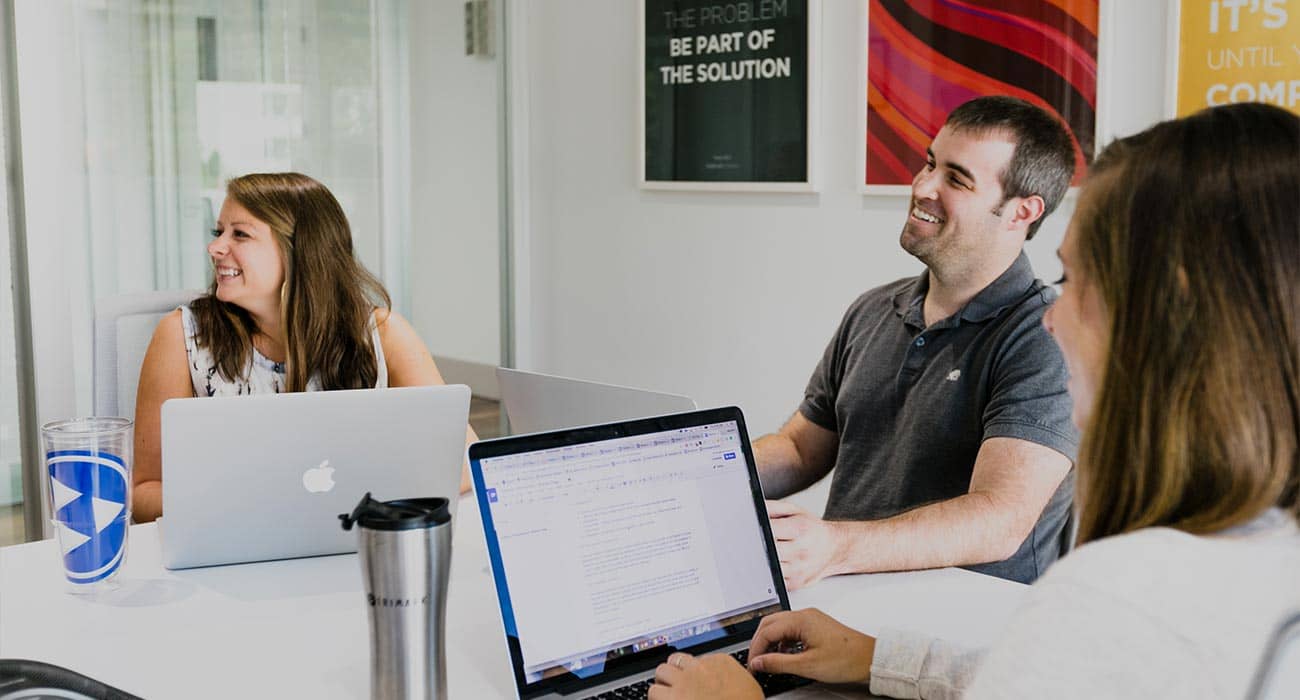 TriMarker employees meeting in a conference room