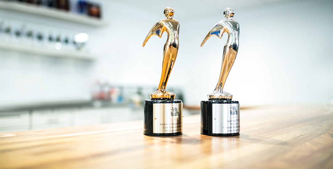 Two Telly Awards on table.