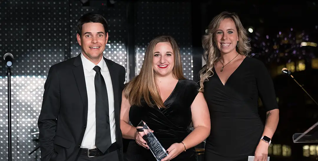 Randy, Rachel and Dani from TriMark Digital accepting Landy Award