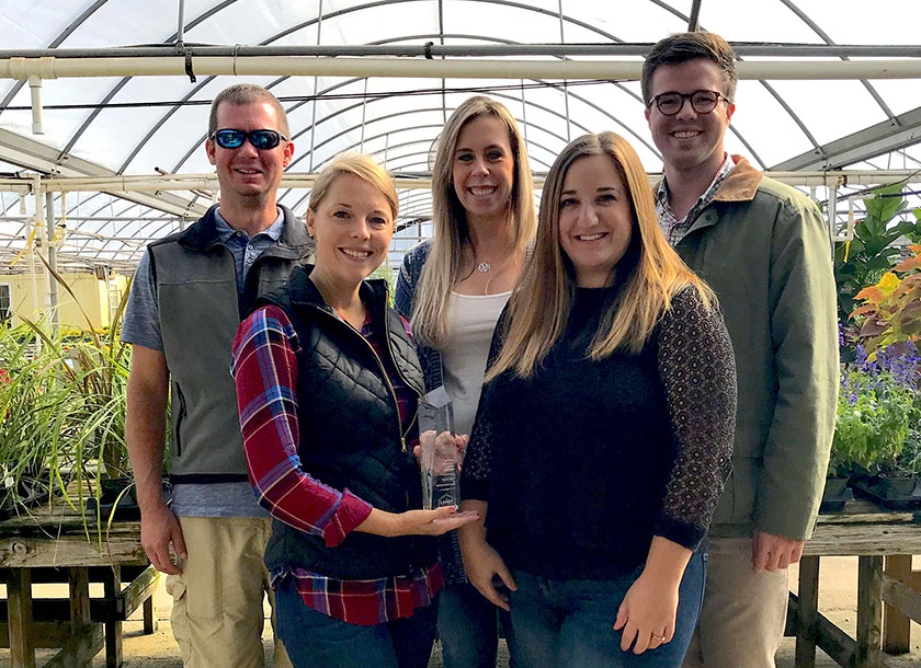 Fairview Garden Center family with TriMark Employees holding their 'Best SEO Initiative - Small Business' award from the the 2017 Search Engine Land Awards