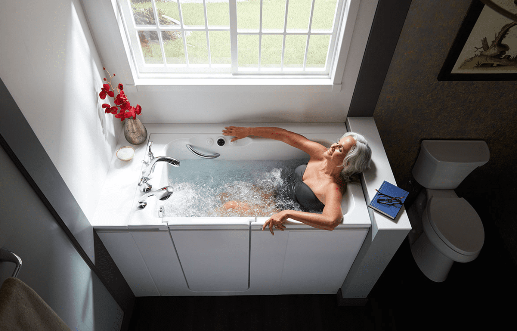 Woman relaxing in walk-in bath with whirlpool hydrotherapy.