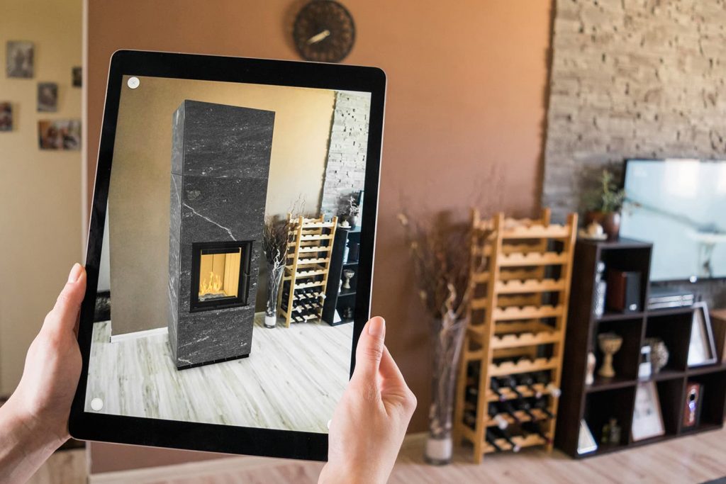 Photo of tablet placing fireplace product in home with AR technology