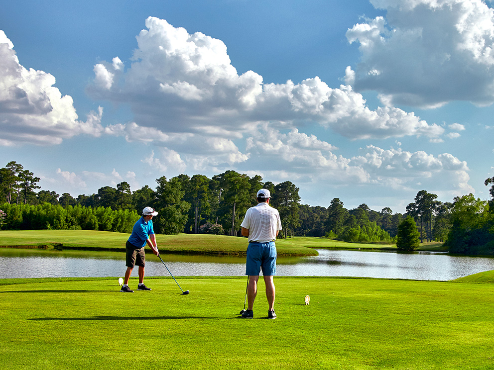 Golfers putting on the Woodlands course