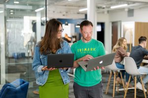 Two TriMark marketers working in office