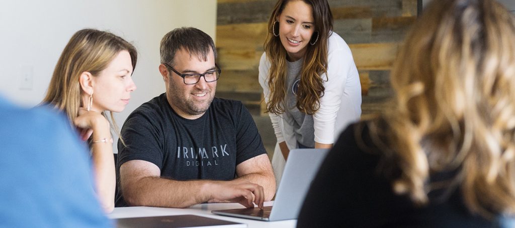 Marketing team with a laptop