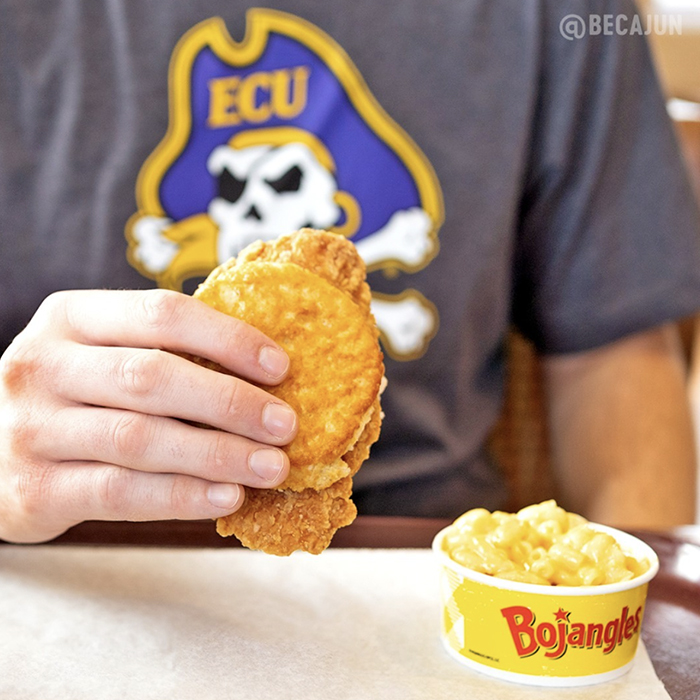 Ecu fan holding up Bojangles Chicken