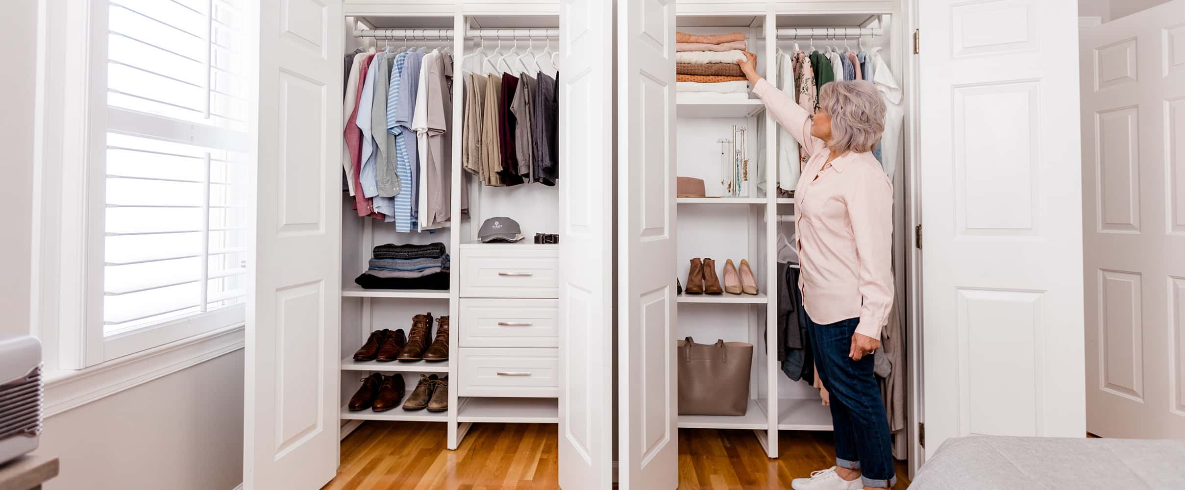 Photo of talent taking sweater from closet system