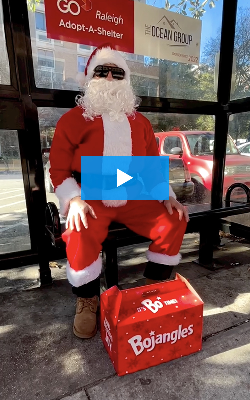 Video thumbnail of santa at the bus stop with Bojangles box