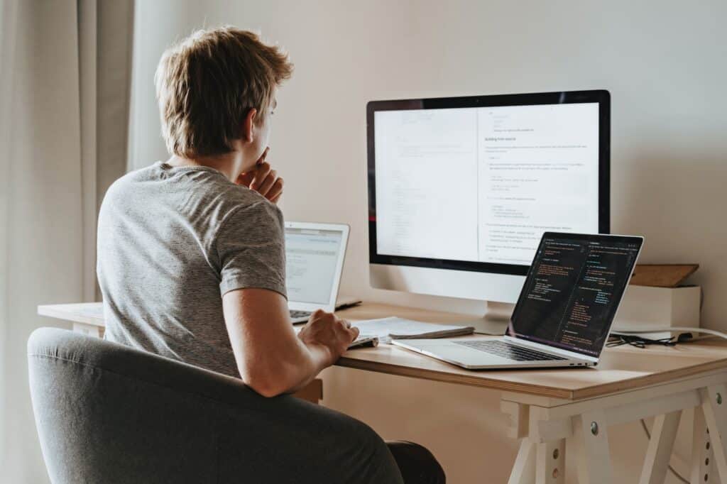 man reading content on computer