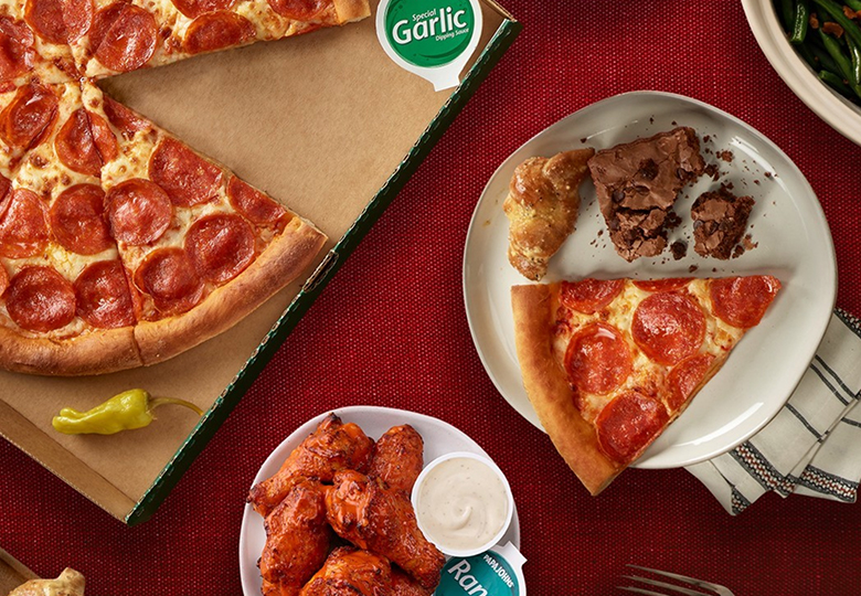 image of various foods for Papa Johns, including pizza slices and chicken wings