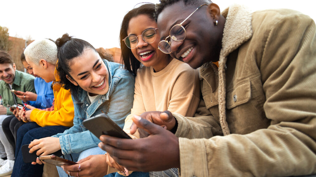 Gen Z on their phones spending time together