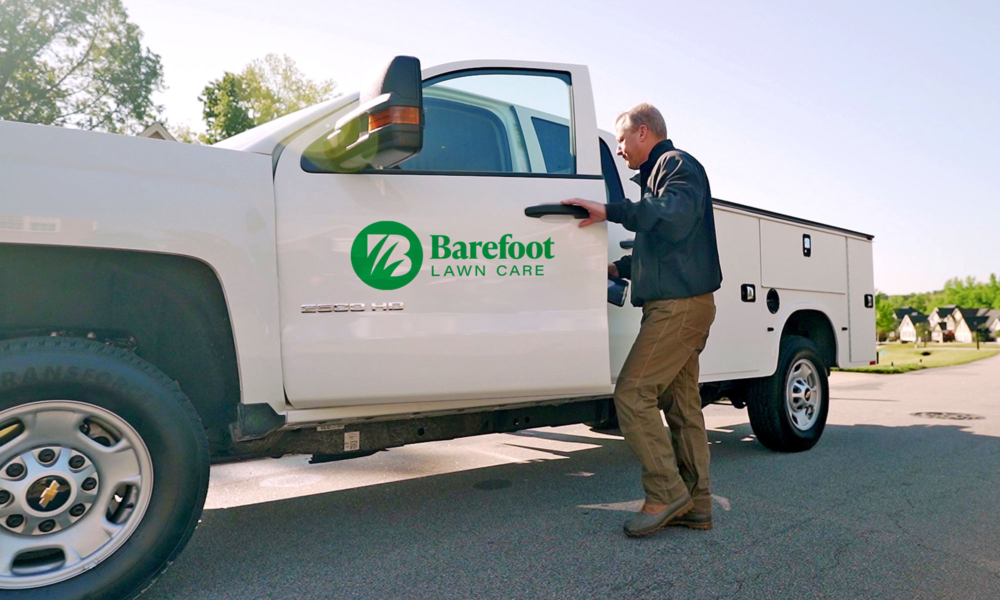 Barefoot Lawn Care logo on truck